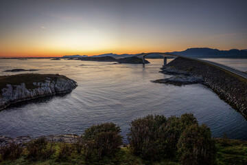 view of the Storseisundet Bridge on the Atlantic Ocean Road at sunrise © makasana photo