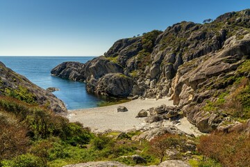 the small cove and beach in the Sandvika hiking area near Stornes in southern Norway