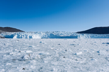 The Mighty Eqi Glacier: A Front View of the Calving Ice Face © Michel