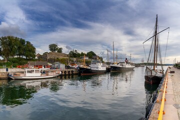 Fototapeta premium old ships on the pier of the Radhusplassen Square in downtown Oslo