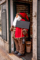 Festive christmas. Santa claus figure, decorations. cozy winter atmosphere with traditional red color, seasonal decoration
