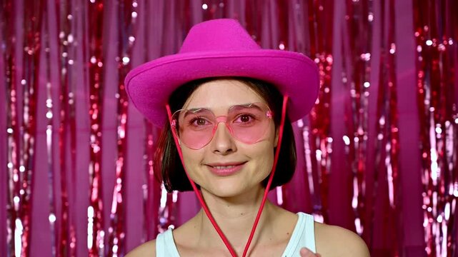 A cheerful girl holding a red rose and enjoying a great mood. The scene reflects fun and positive emotions during a party or celebration, suitable for Valentine&rsquo;s Day, a bachelorette party,