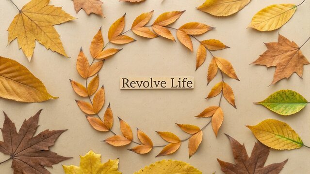 Autumn Leaves Arranged in a Wreath with Revolve Life Text - Powered by Adobe