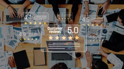 A diverse business team collaborates in a modern office, analyzing customer reviews and performance metrics displayed on their laptops during an engaging strategy meeting. Raster - Powered by Adobe