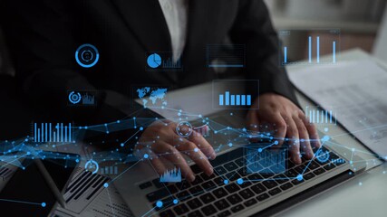A business professional engages with a laptop surrounded by digital data visualizations that represent analytics and modern technology in a professional workspace. Xenic