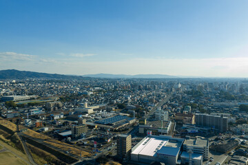 Aerial view of residential area and cityscape in Kurume, Fukuoka, Japan.