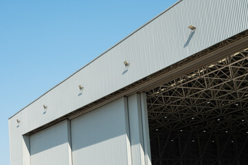 Large industrial warehouse building with sliding metal doors