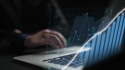 Hands interacting with a laptop on a dark surface, combined with a dynamic digital graph overlay, illustrating financial growth and analysis in a modern workspace. Copula - Powered by Adobe