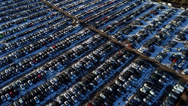 Aerial view of the vast BCA car storage facility, showcasing rows of cars parked on the ground in Corby, Northamptonshire, United Kingdom.