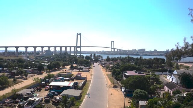 Aerial view of the Maputo-Katembe bridge soaring above the landscape, with the city skyline in the distance, Maputo, Mozambique.