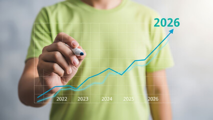Businessman drawing upward trend line forecast from 2022 to 2026 showing business growth