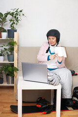 Portrait of a woman in a mountain skiing office. Home office and mountain dreams.