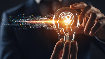 Digital innovation concept: hand holding light bulb with brain gears and data flow