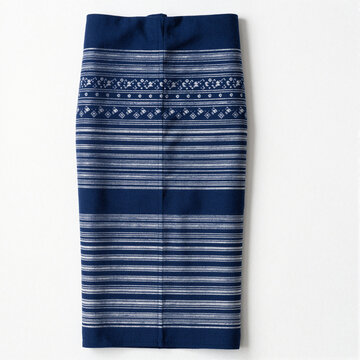 Laotian sinh skirt with indigo and white geometric woven patterns, folded and centered on a white background