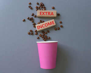Extra Income symbol. Concept words Extra Income on beautiful wooden picture frame. Beautiful grey background with coffee cup and coffee beans. Business and Extra Income concept. Copy space.