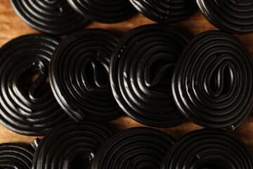 Natural licorice candies on wooden table, closeup