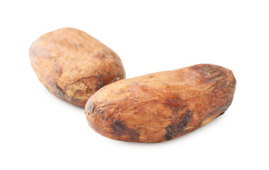 Obraz premium Two natural cocoa beans isolated on white