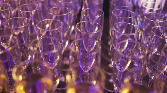 Alcohol setting on catering banquet table, bartender pouring liquor beverages, row line of different colored alcohol drinks on party, glass of wine, sparkling wine on decorated banquet table event