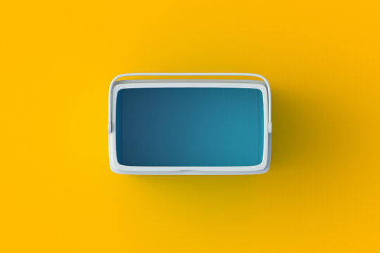Open portable fridge on blue background. Ice cooler. Freezer box for beverage or food. Equipment for picnic. Top view. 3d render