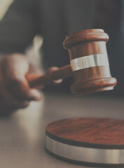 Judge with gavel on table