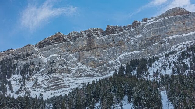 Time lapse, clouds passing over mountains covered with snow. Canton of St. Gallen, Switzerland