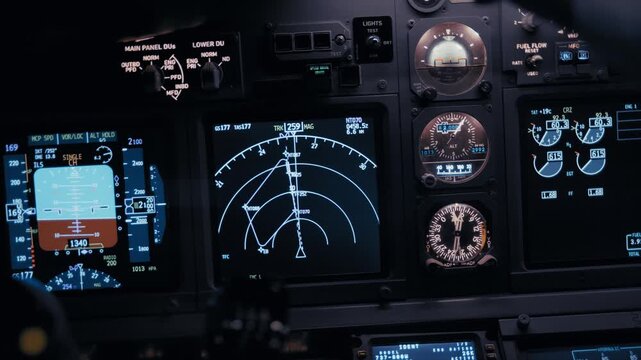 Cockpit avionics panel with flight instruments during flight