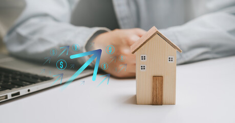 Real estate investment concept, wooden house model with upward financial arrows, property value growth, housing market forecast, wealth building, long term asset planning