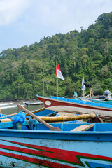 Traditional wooden fishing boats line Rajegwesi Beach, Banyuwangi, as fishermen prepare to head out to sea, capturing coastal livelihoods, maritime traditions, and daily life on Java&rsquo;s southern coast.