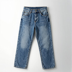 High-waisted blue denim jeans with faded texture and rolled cuffs, centered on a white background