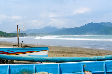 Traditional wooden fishing boats line Rajegwesi Beach, Banyuwangi, as fishermen prepare to head out to sea, capturing coastal livelihoods, maritime traditions, and daily life on Java&rsquo;s southern coast.