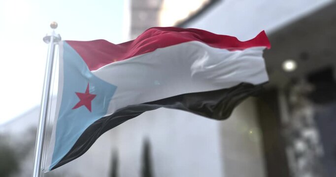 Historical South Yemen Movement Flag Waving for Political and Regional Context. Footage of the flag used by the Southern Movement (Al-Hirak) in Yemen, featuring the blue triangle and red star. Essenti