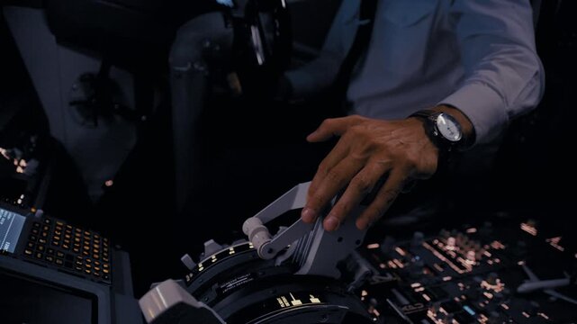 Pilot's Hands on the Thrust Levers for Landing