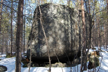 A mountain tundra landscape in Lapland in late spring, with snow still on the ground.