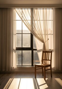 Empty chair near window creating quiet and reflective mood.