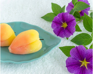 Traditional Japanese Wagashi Sweets with Purple Flowers