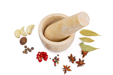 A stone mortar and spices that can be ground in a mortar.