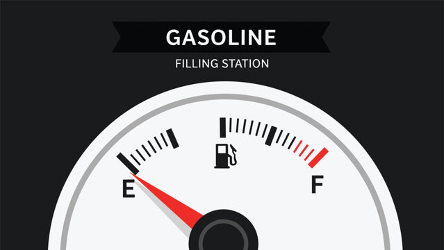 Close up view of a car fuel gauge indicates that the gasoline tank is nearly empty with the red needle pointing towards the letter e on the dial.