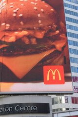 Naklejka premium ad for McDonald's Canada on electronic billboard over entrance to CF Toronto Eaton Centre facing Sankofa Square, Toronto