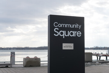 Naklejka premium Community Square sign at Harbourfront Centre with view of Toronto Harbor