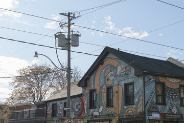 Naklejka premium exterior building facades with mural and sign of Collective Arts, a brewery/bar/retail space, located at 777 Dundas St W, Toronto