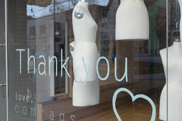 Naklejka premium exterior display window with dressmaker forms at the former location of Comrags, a Canadian fashion brand and boutique located at 812 Dundas St W in Toronto’s Trinity‑Bellwoods area