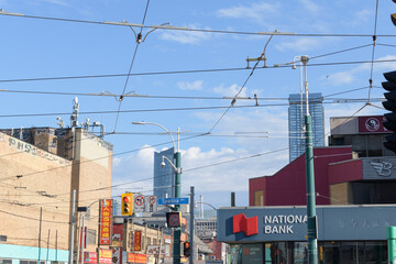 Naklejka premium wide view looking east on Dundas St W at the intersection of Spadina Av (National Bank of Canada branch located at 501 Dundas St W), Toronto