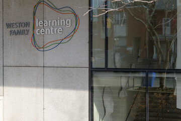 Naklejka premium Weston Family Learning Centre sign on the west edge of the Art Gallery of Ontario, 317 Dundas St W, Toronto