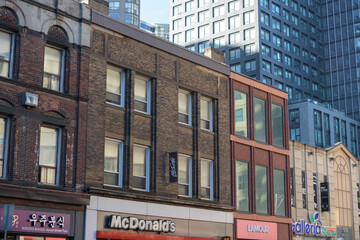 Naklejka premium exterior of historic buildings facing Yonge St incl McDonald's Canada fast food restaurant at 552 Yonge St, Toronto