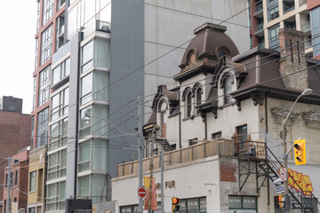 Naklejka premium exterior of HS Strathy House, a heritage property at 342 Adelaide St W, Toronto, completed 1858 with later additions, a mansard roof in 1876 and a ground‑floor store in 1912, site of New York Fur, Tor