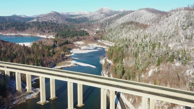 Viaduct Bajer above lake, scenic highway in Gorski Kotar region of Croatia in winter
