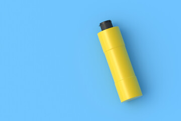 Acrylic paint bottle on blue background. Top view. Copy space. 3d render
