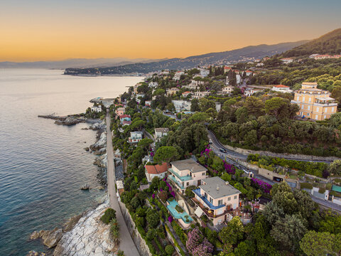 Panoramic aerial view of Varazze, Liguria region, province of Savona, Italy. A beautiful view of the coast surrounded by green hills l Beigua regional natural park, UNESCO geopark. 