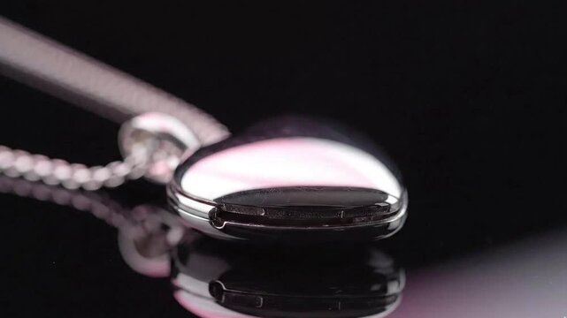 Silver heart locket reflection detail