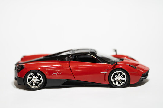 Bucharest Romania 11 January 2026.Red Pagani toy car scale model isolated on white background. Detailed miniature supercar with sleek design and realistic details.
